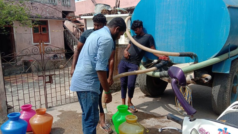 Residents collecting water